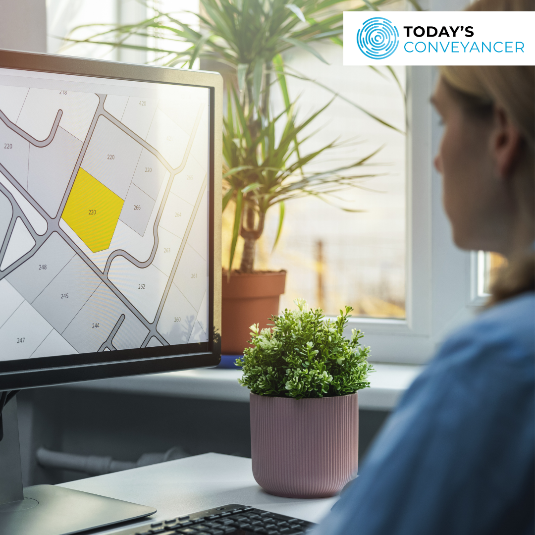 Woman working on PC looking at land parcels